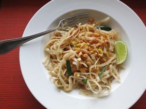 Phad Thai is commonly eaten with a fork and spoon.